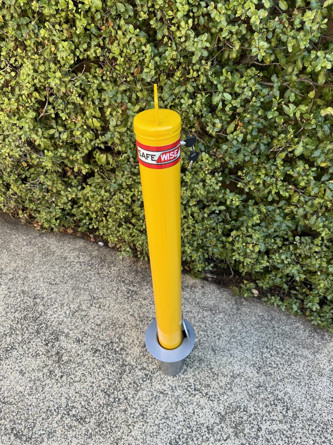 Removable bollard seated in its in-ground sleeve