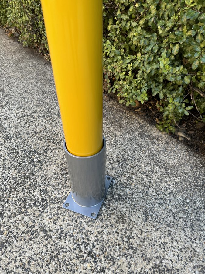 Close-up of bollard collar at ground level