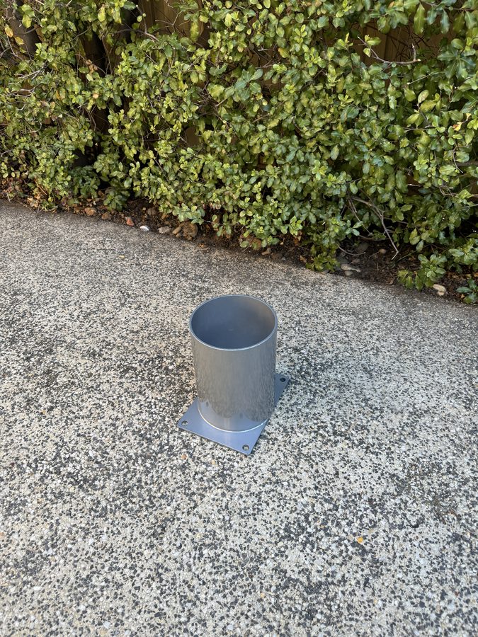 90mm in-ground bollard sleeve set into concrete