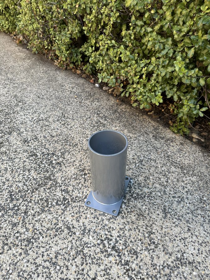 140mm in-ground bollard sleeve set into concrete